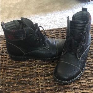 Black Clark’s combat boots with red plaid on top